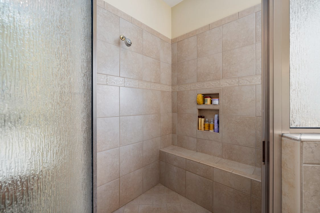 bathroom accessibility upgrades featuring barrier free walk in shower with built in bench
