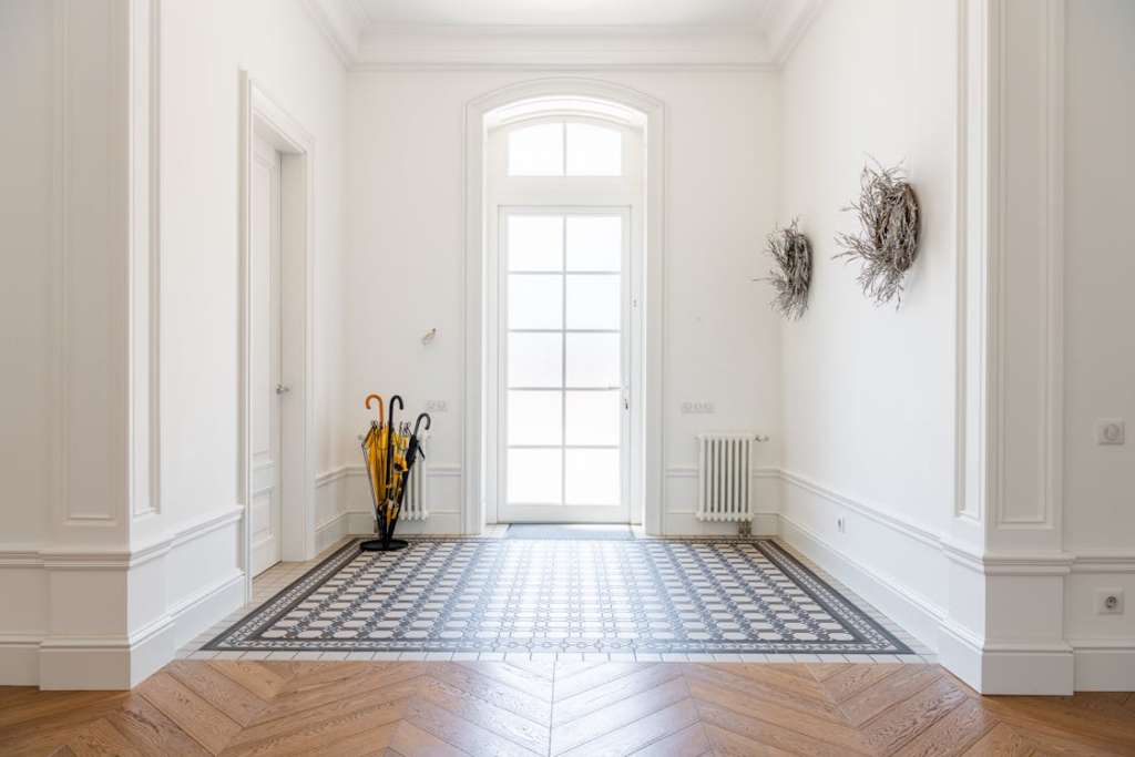 entryway renovation ideas with bright modern entry hall, durable tile flooring and natural light