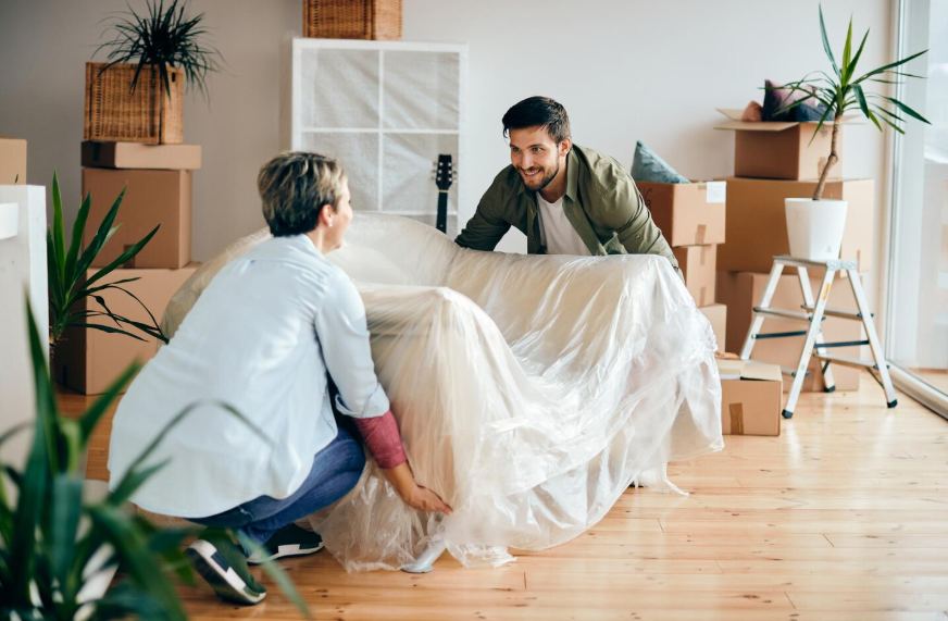 prepare home for renovation by covering furniture and packing belongings