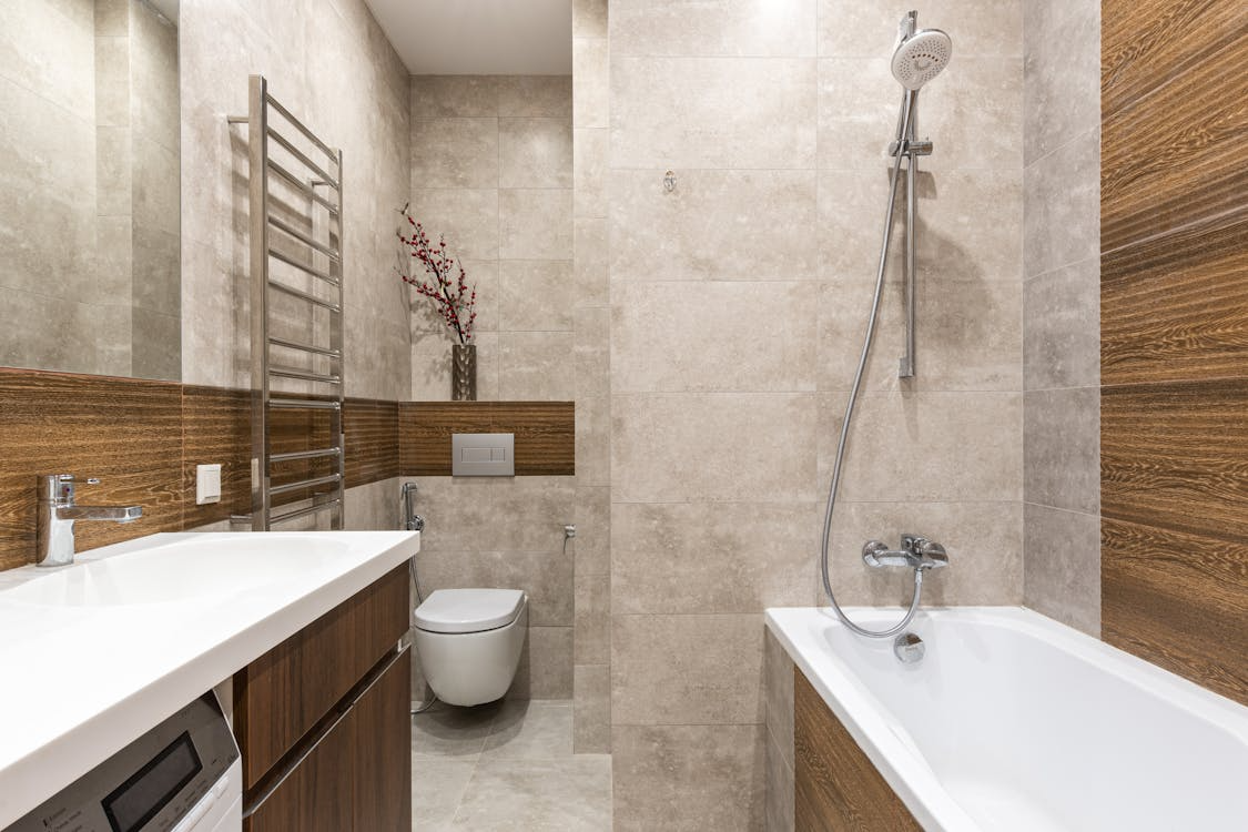 timeless bathroom design ideas featuring neutral color palette, durable tile, and modern fixtures