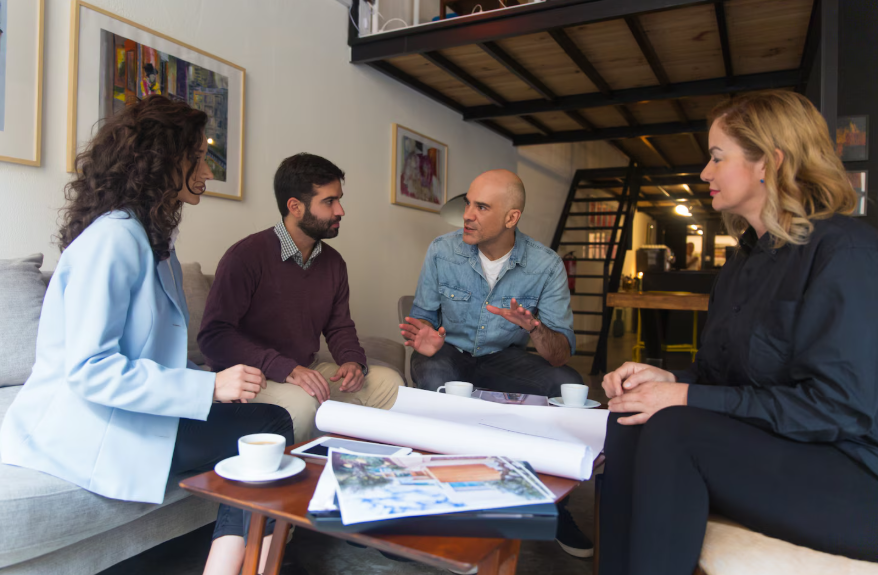 homeowners discussing renovation plans and questions to ask a remodeling contractor before hiring