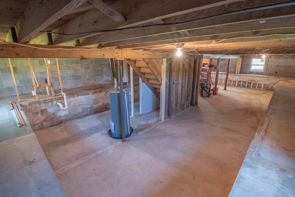 unfinished basement remodel ideas showing raw basement space before renovation