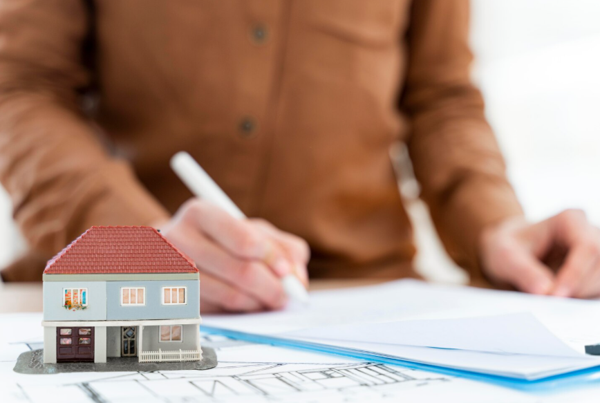 remodeling permits and building codes planning with house model and construction documents